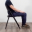 NPS 1410 AirFlex folding chair in black - seated