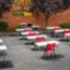 NPS 640 heavy‑duty folding chair with 19‑gauge steel frame in red - outside school